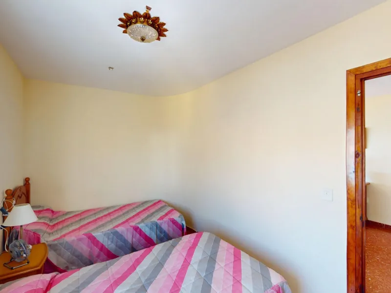Discover this exceptional 3-bedroom apartment located on one of Torre del Mars main streets, just steps from the beach. This frontline property offers stunning panoramic sea views from all three bedrooms, with two featuring built-in wardrobes for added co