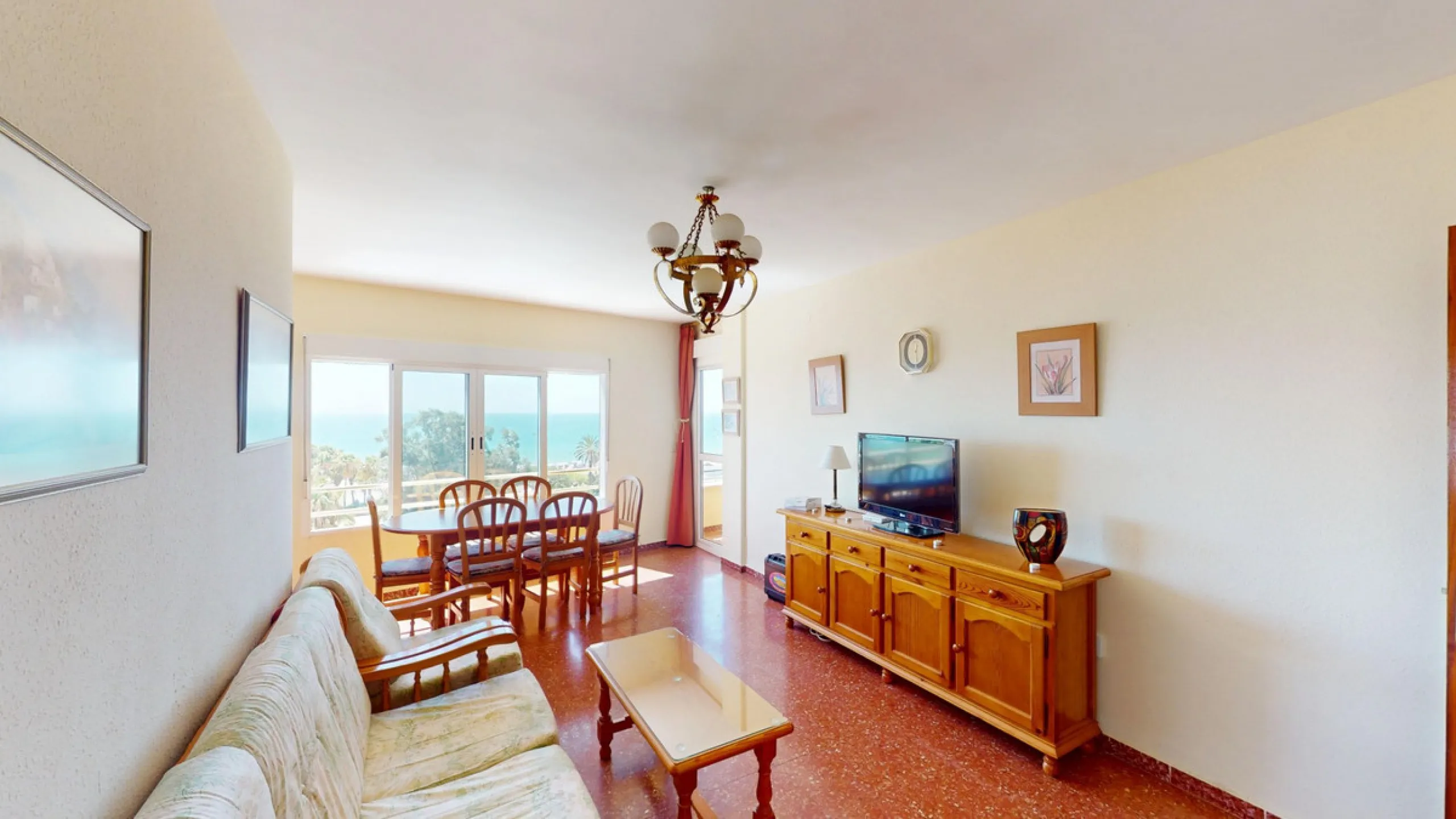 Discover this exceptional 3-bedroom apartment located on one of Torre del Mars main streets, just steps from the beach. This frontline property offers stunning panoramic sea views from all three bedrooms, with two featuring built-in wardrobes for added co