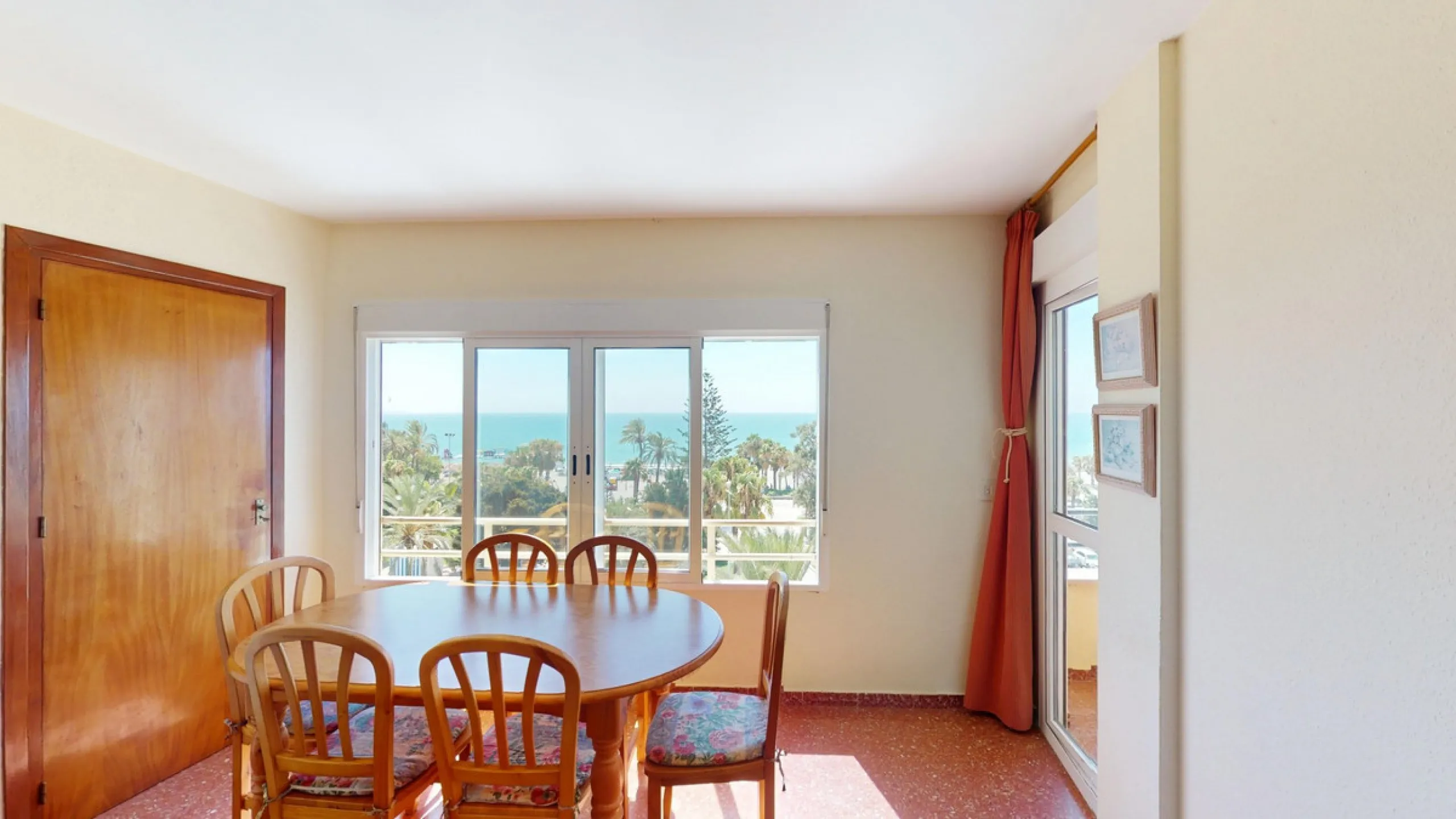 Discover this exceptional 3-bedroom apartment located on one of Torre del Mars main streets, just steps from the beach. This frontline property offers stunning panoramic sea views from all three bedrooms, with two featuring built-in wardrobes for added co