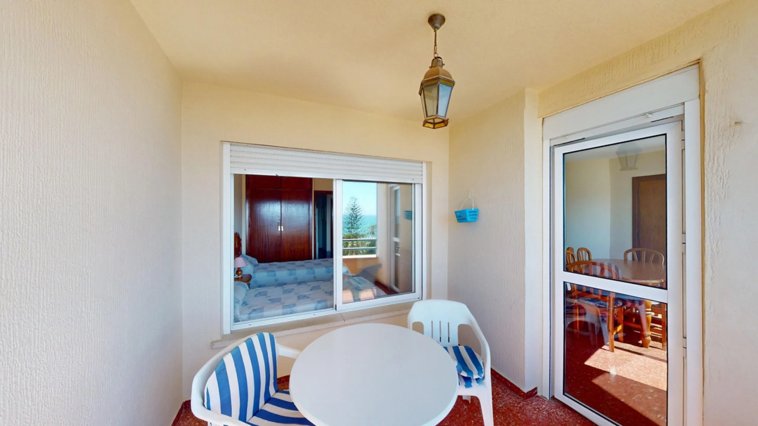 Discover this exceptional 3-bedroom apartment located on one of Torre del Mars main streets, just steps from the beach. This frontline property offers stunning panoramic sea views from all three bedrooms, with two featuring built-in wardrobes for added co