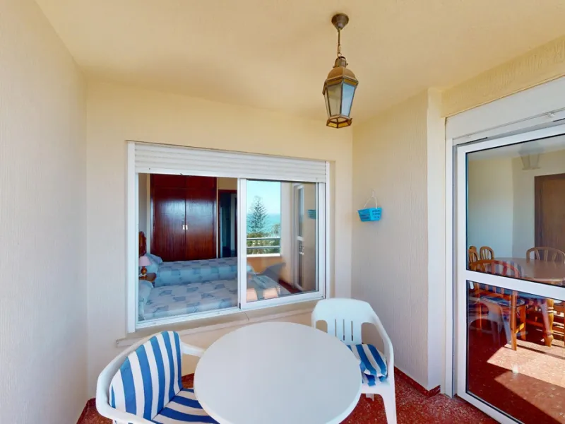 Discover this exceptional 3-bedroom apartment located on one of Torre del Mars main streets, just steps from the beach. This frontline property offers stunning panoramic sea views from all three bedrooms, with two featuring built-in wardrobes for added co