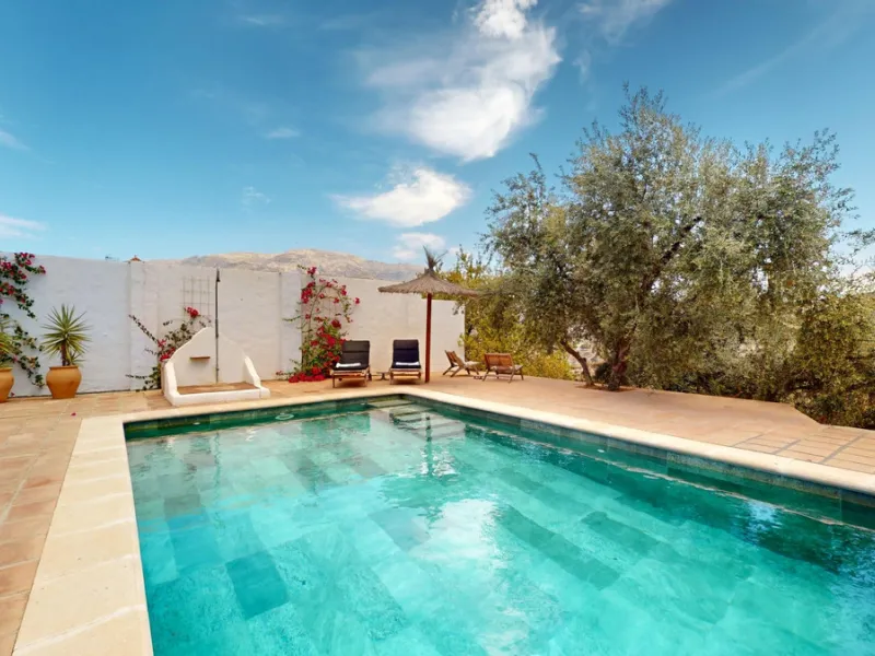 Nestled in the hills of Arenas, Málaga, this enchanting cortijo is more than just a home it's a Mediterranean haven full of character, peace, and possibility. Divided into three separate apartments, its perfectly suited for use as a charming B&B or a spac