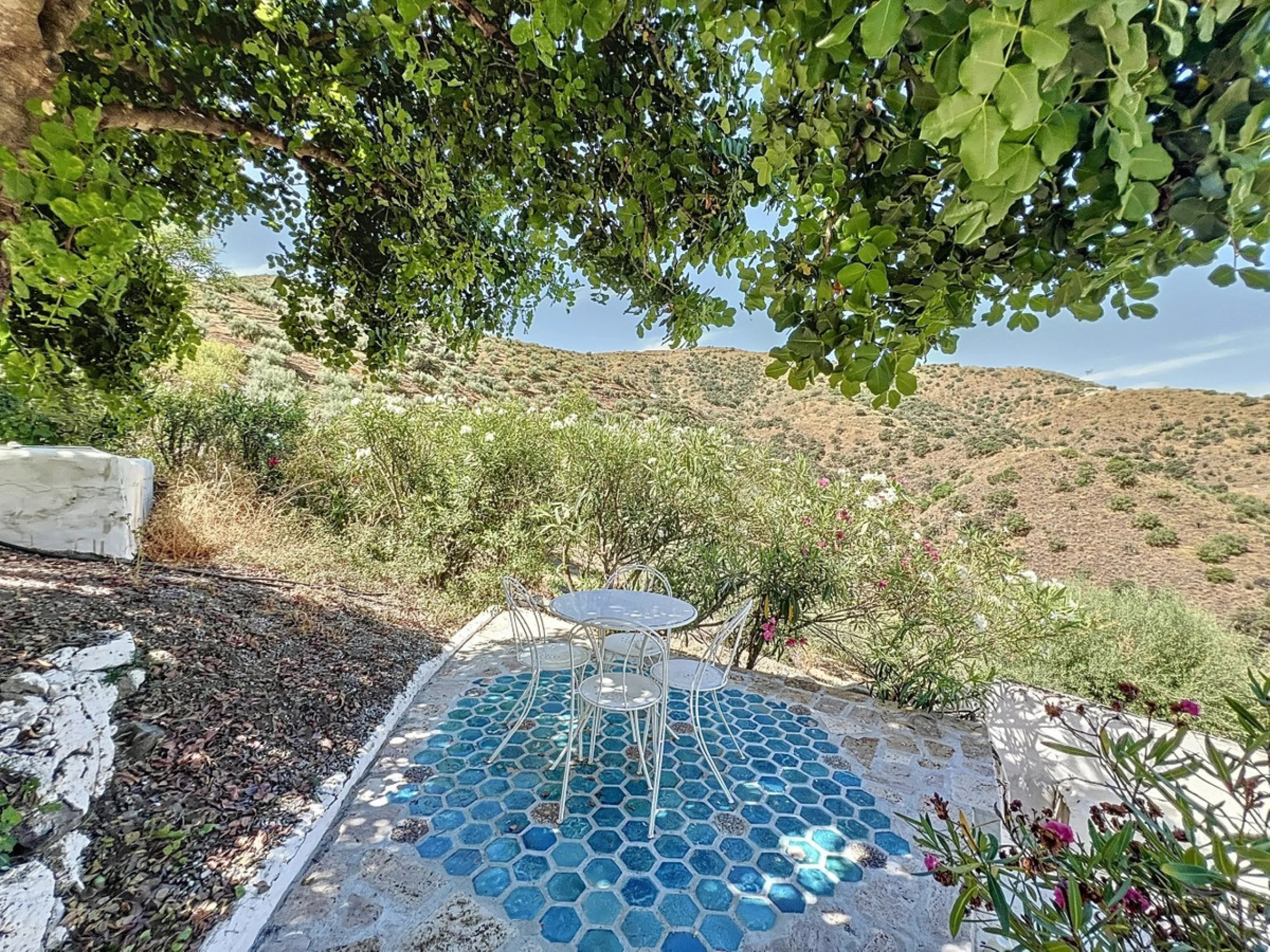 Nestled in the hills of Arenas, Málaga, this enchanting cortijo is more than just a home it's a Mediterranean haven full of character, peace, and possibility. Divided into three separate apartments, its perfectly suited for use as a charming B&B or a spac