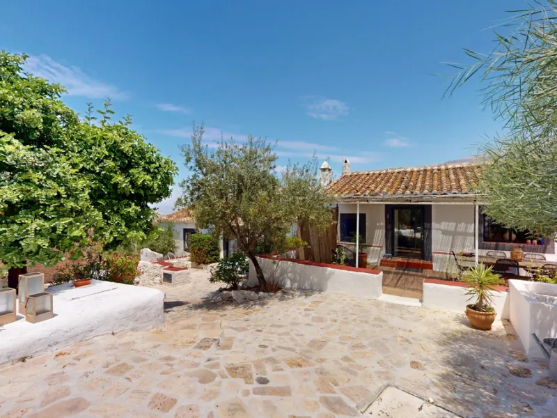 Nestled in the hills of Arenas, Málaga, this enchanting cortijo is more than just a home it's a Mediterranean haven full of character, peace, and possibility. Divided into three separate apartments, its perfectly suited for use as a charming B&B or a spac