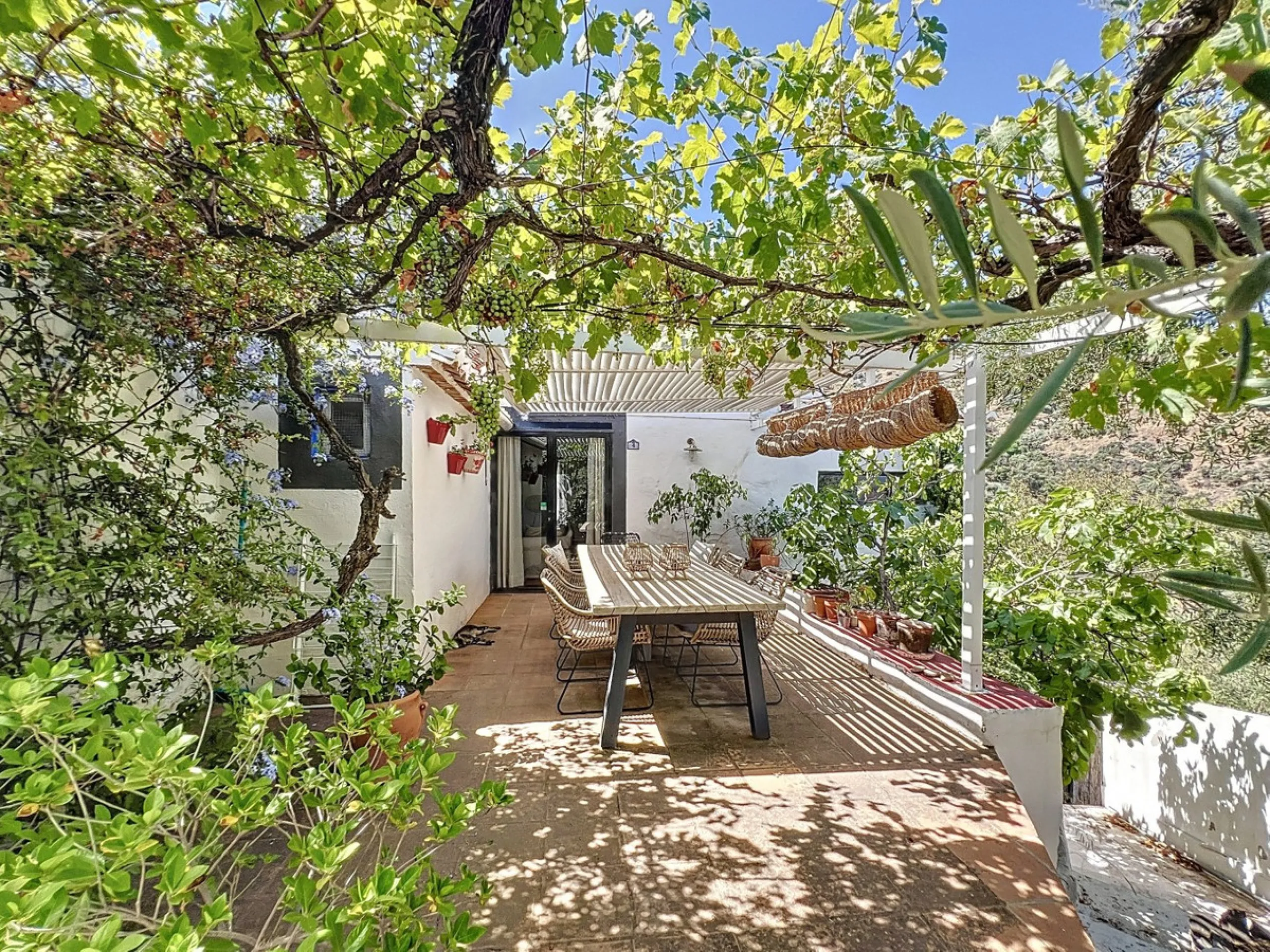 Nestled in the hills of Arenas, Málaga, this enchanting cortijo is more than just a home it's a Mediterranean haven full of character, peace, and possibility. Divided into three separate apartments, its perfectly suited for use as a charming B&B or a spac