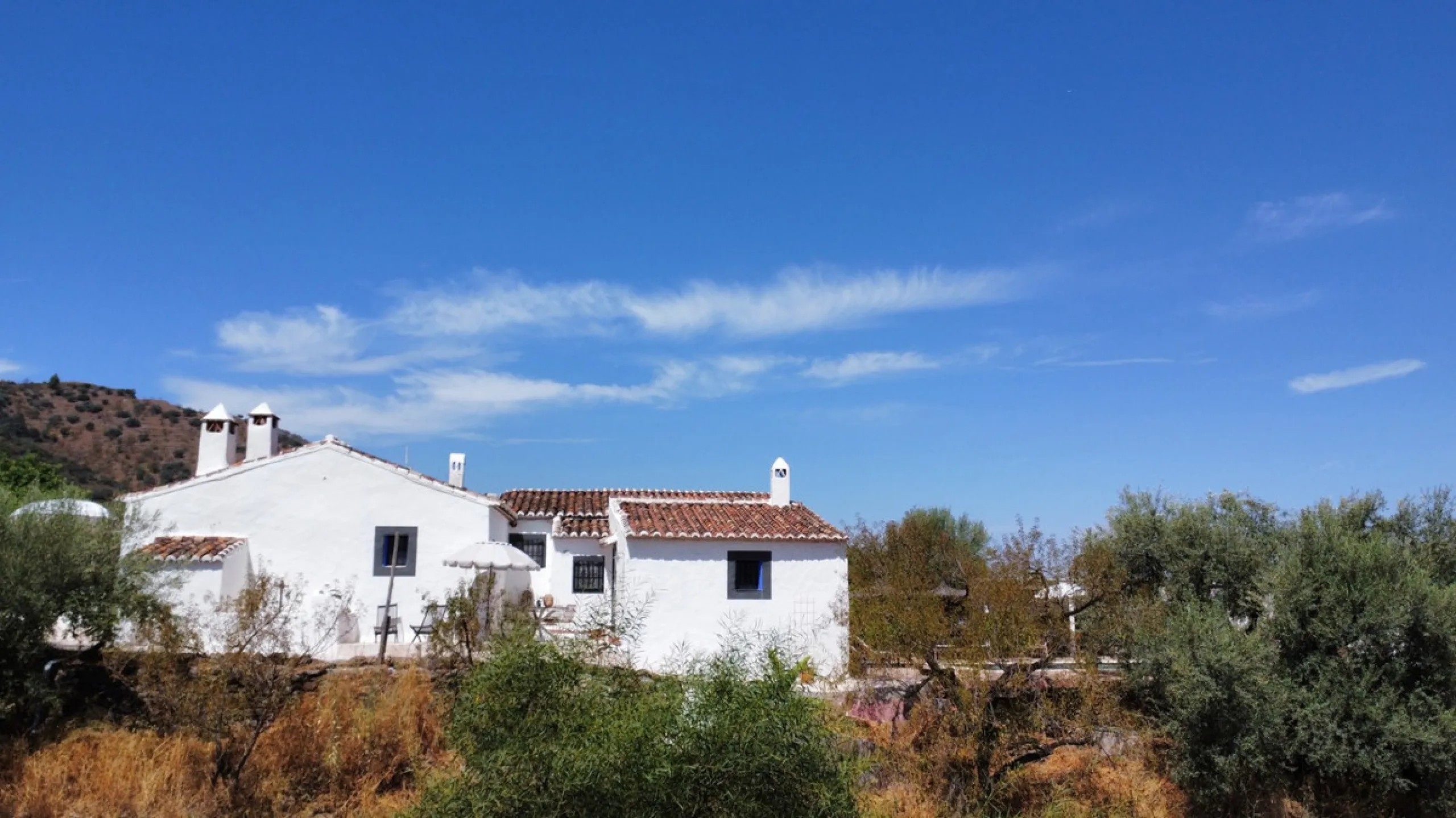 Nestled in the hills of Arenas, Málaga, this enchanting cortijo is more than just a home it's a Mediterranean haven full of character, peace, and possibility. Divided into three separate apartments, its perfectly suited for use as a charming B&B or a spac