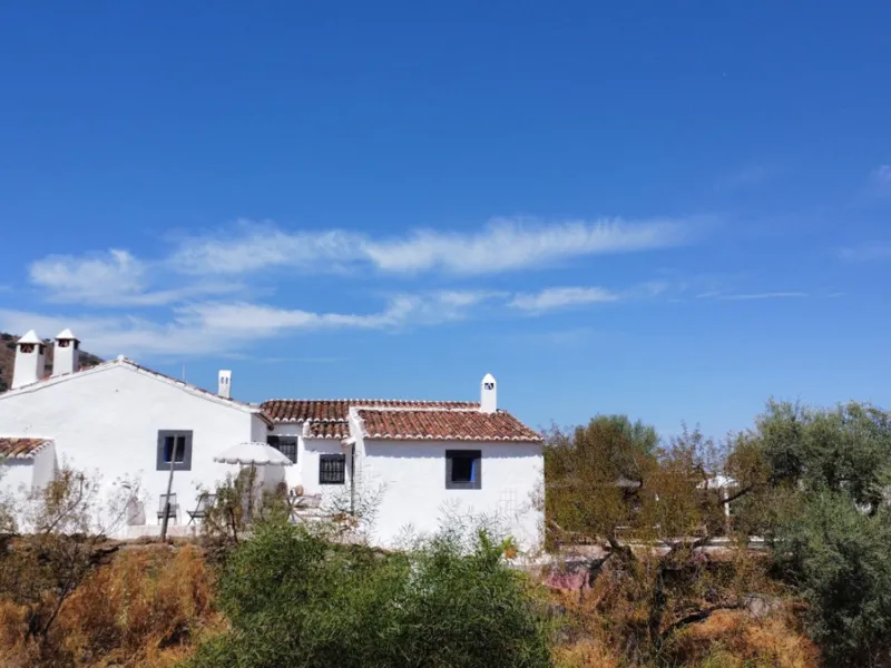 Nestled in the hills of Arenas, Málaga, this enchanting cortijo is more than just a home it's a Mediterranean haven full of character, peace, and possibility. Divided into three separate apartments, its perfectly suited for use as a charming B&B or a spac
