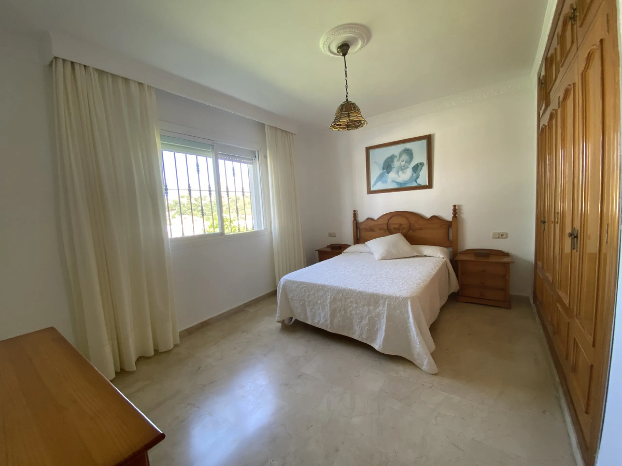 Tucked away in the peaceful El Velerín area of Estepona's prestigious New Golden Mile, this delightful detached villa offers the perfect blend of rustic charm, comfort and outdoor living.