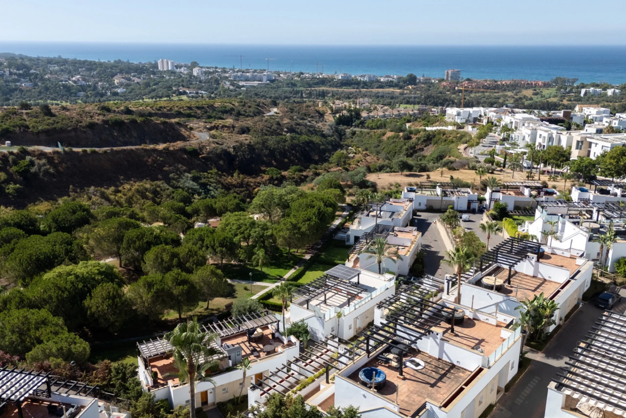 Experience effortless coastal living in Townhouse Targa, a modern Mediterranean home in the heart of Marbella East. This elegant townhouse sits in a secure gated community close to golden beaches and leading golf courses. Designed across three levels, it 