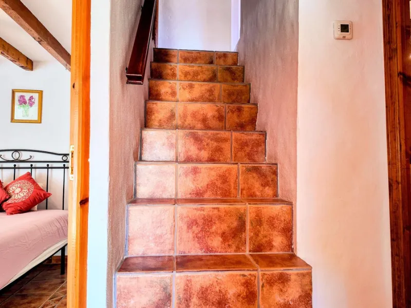 This charming property features a spacious 3-bedroom, 1-bathroom house with two levels, located in the peaceful Barranco del Sol neighborhood. only 25 min drive to Malaga
