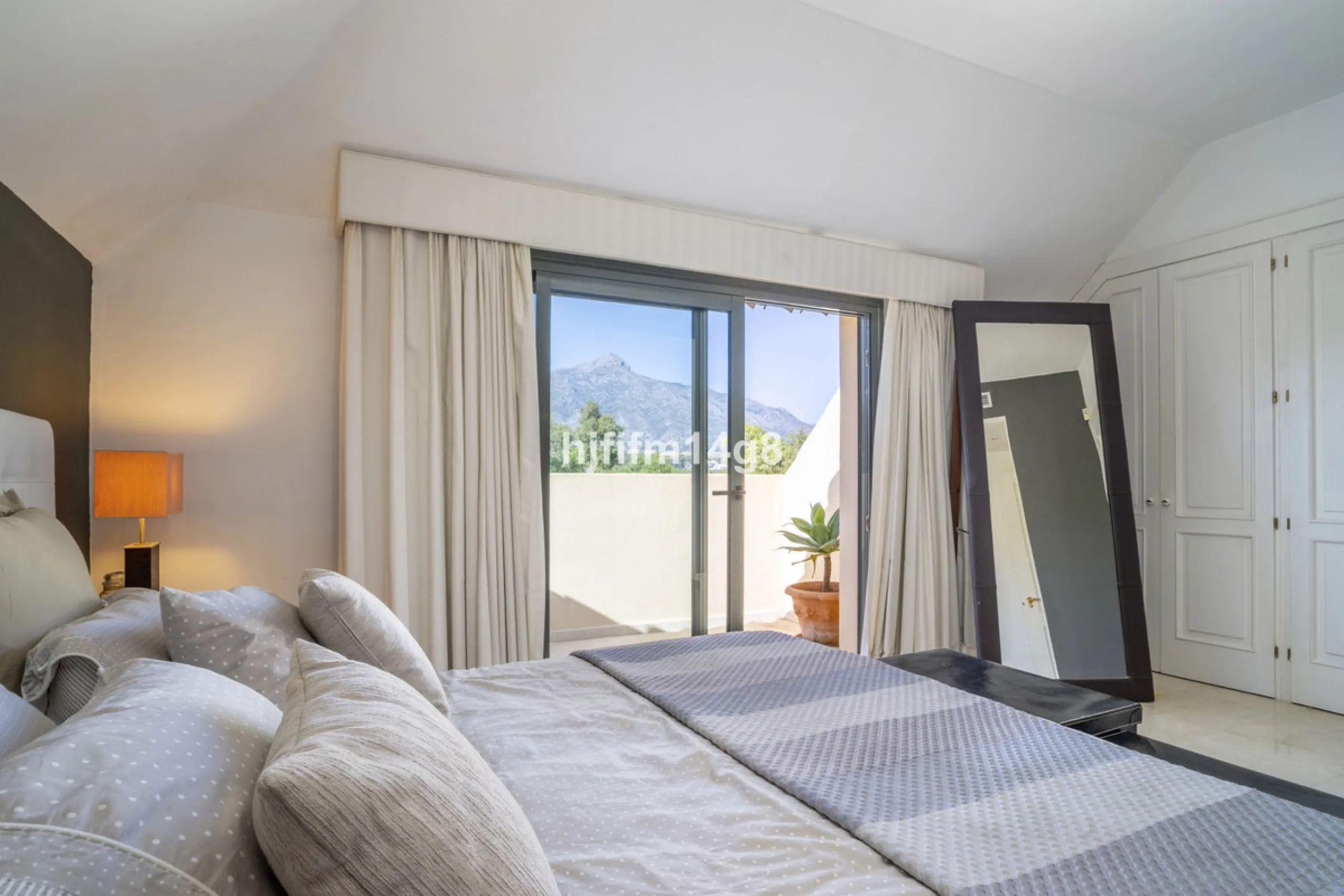 Welcome to this bright and spacious 2-bedroom penthouse in the sought-after Lorcrigolf community, perfectly positioned next to the golf course and offering spectacular views of La Concha Mountain.