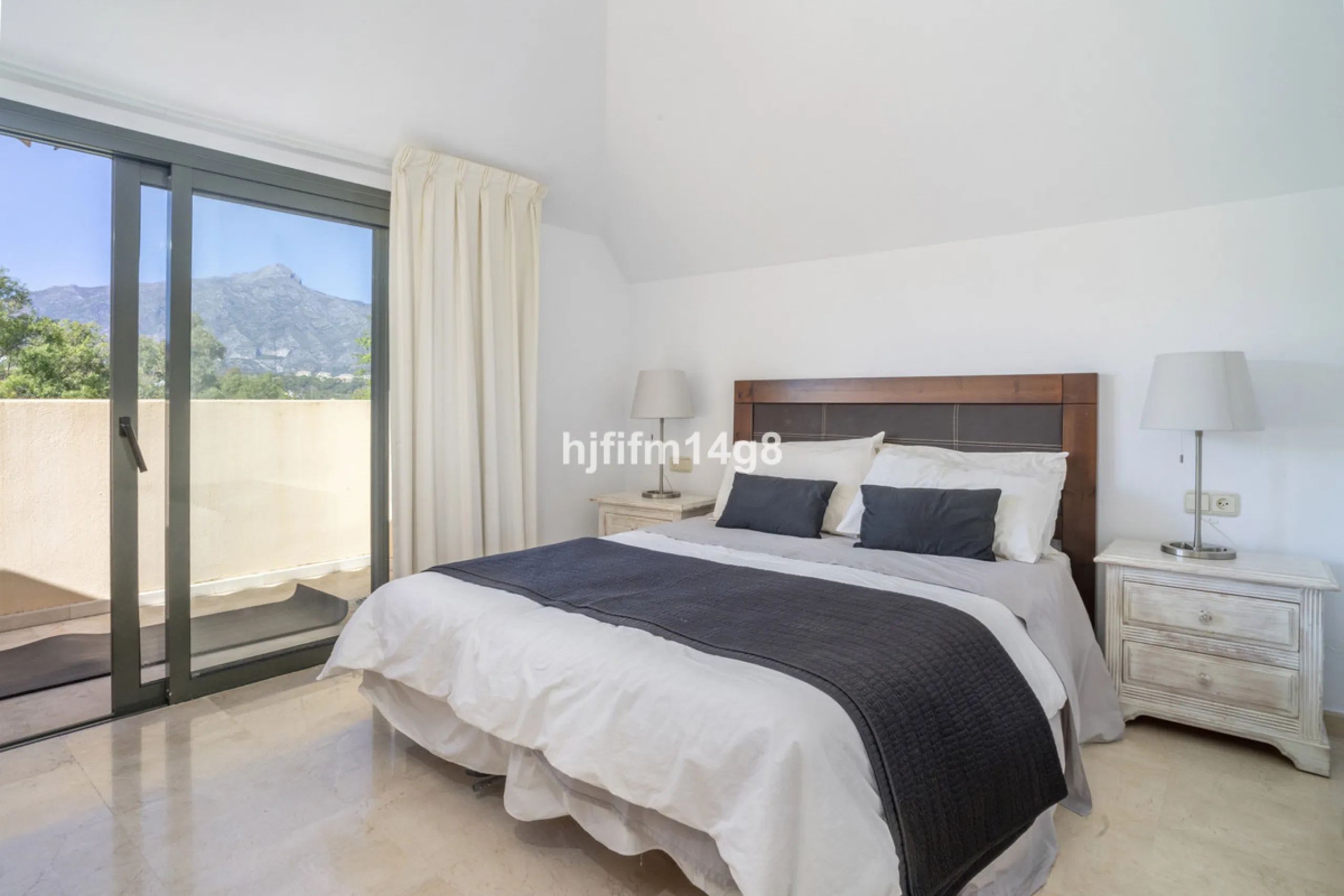 Welcome to this bright and spacious 2-bedroom penthouse in the sought-after Lorcrigolf community, perfectly positioned next to the golf course and offering spectacular views of La Concha Mountain.