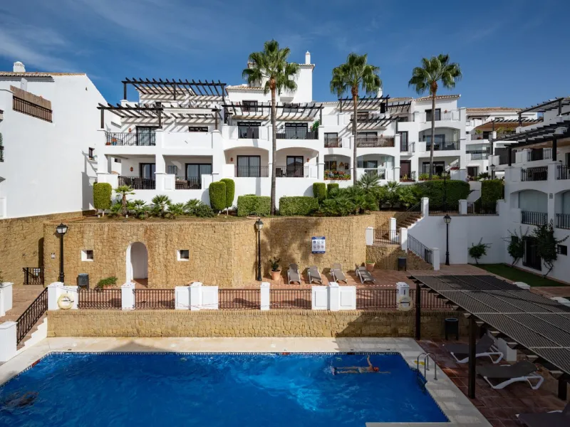 Discover this exquisite duplex penthouse nestled in a charming, white-washed Andalusian village-style urbanisation, found in the heart of Altos de Los Monteros, Marbella.