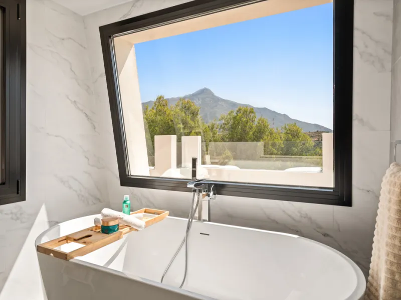 Located in one of Marbella's most sought-after residential areas, this five-bedroom, five-bathroom villa offers panoramic, frontal views of the Mediterranean Sea, La Concha mountain, and Puerto Banús. Positioned on a 1,950 m² plot, the property includes 4