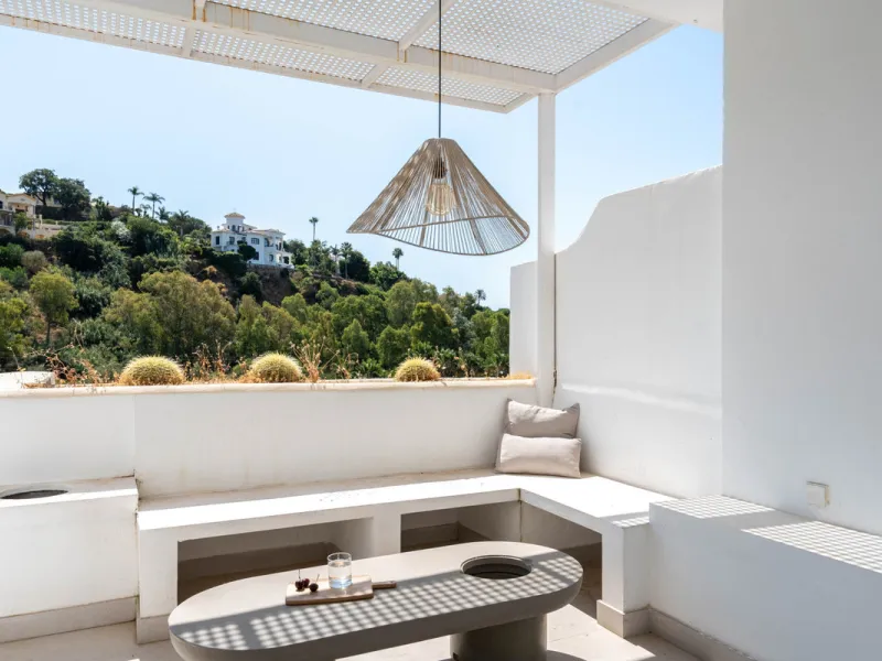 This exceptional top-floor apartment offers a unique blend of modern elegance, comfort, and natural beauty. Fully renovated with meticulous attention to detail, the home features handcrafted wooden furnishings, premium appliances, and a spacious, light-fi