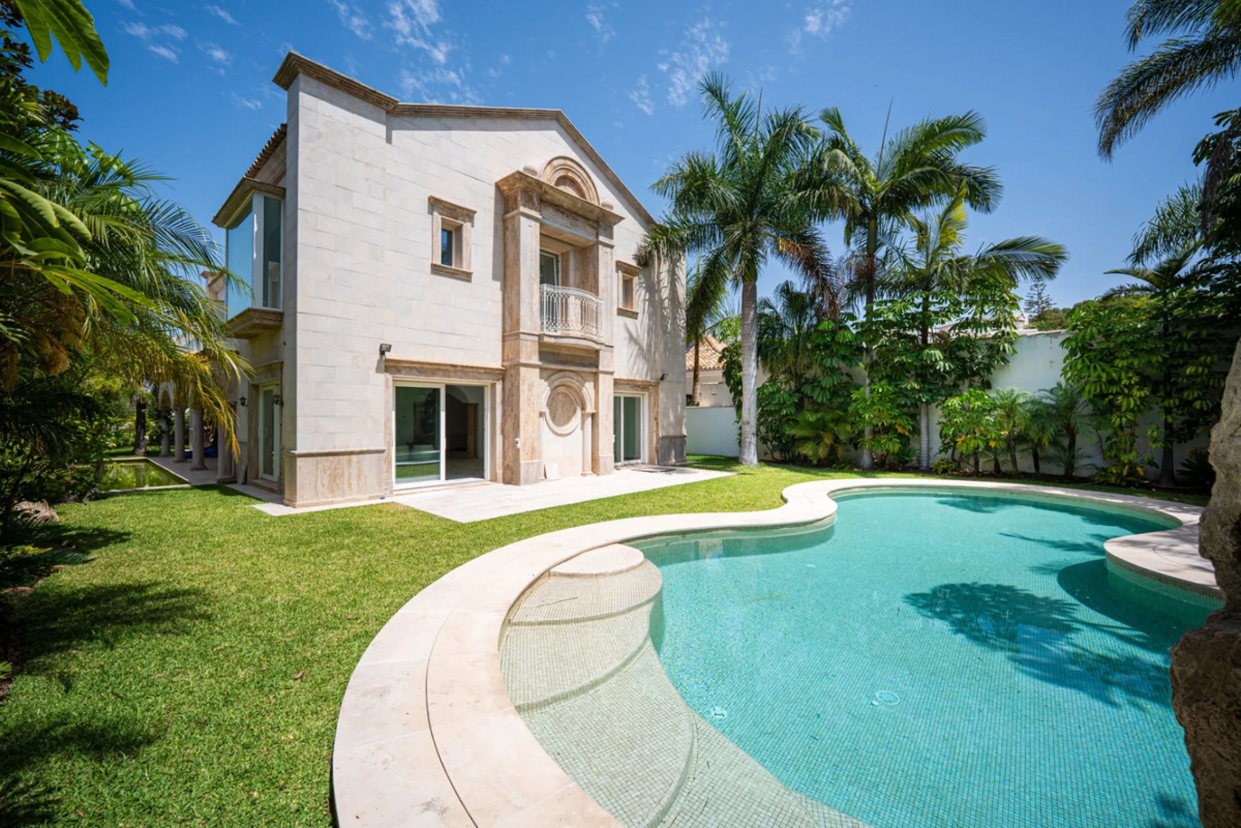 Villa Roma is a stunning four-bedroom, four-bathroom home in the exclusive beachside area of Los Monteros, Marbella East. Just a short walk from the beach, this elegant villa sits on a 933m² plot and combines classic European design with modern coastal co