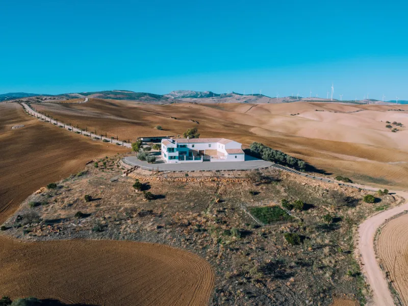 Set on a vast 270,000 m² estate near Ardales and the popular Caminito del Rey, this stunning cortijo blends recent renovations with preserved traditional features—thick stone walls, wooden beams, and classic doors—offering comfort without compromising cha
