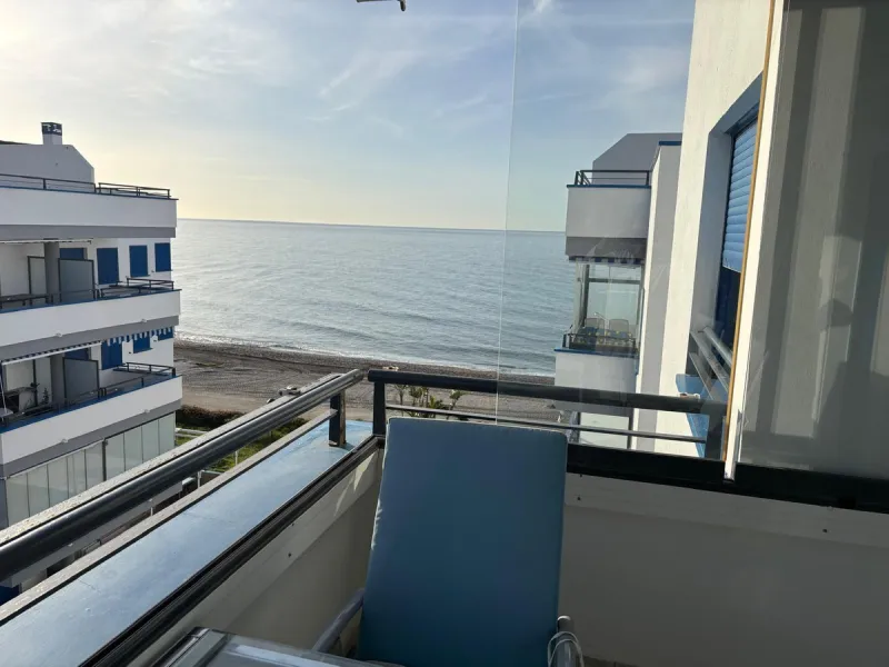 Frontline top floor duplex apartment located on the beach of El Peñoncillo in Torrox-Costa with direct access to the sea.