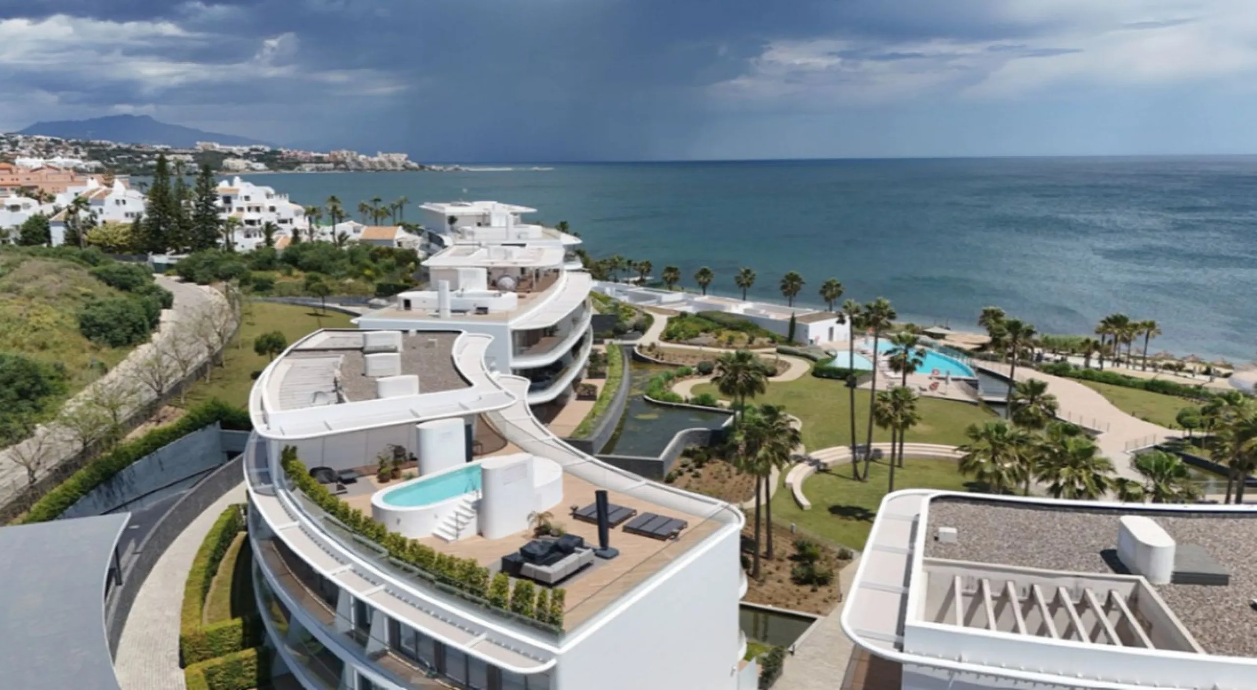 Welcome to this luxurious apartment located in the exclusive beachfront residential complex The Edge. This 2nd floor home offers four bedrooms and two bathrooms with exclusive Dornbracht finishes. The open concept living room and kitchen create a social a