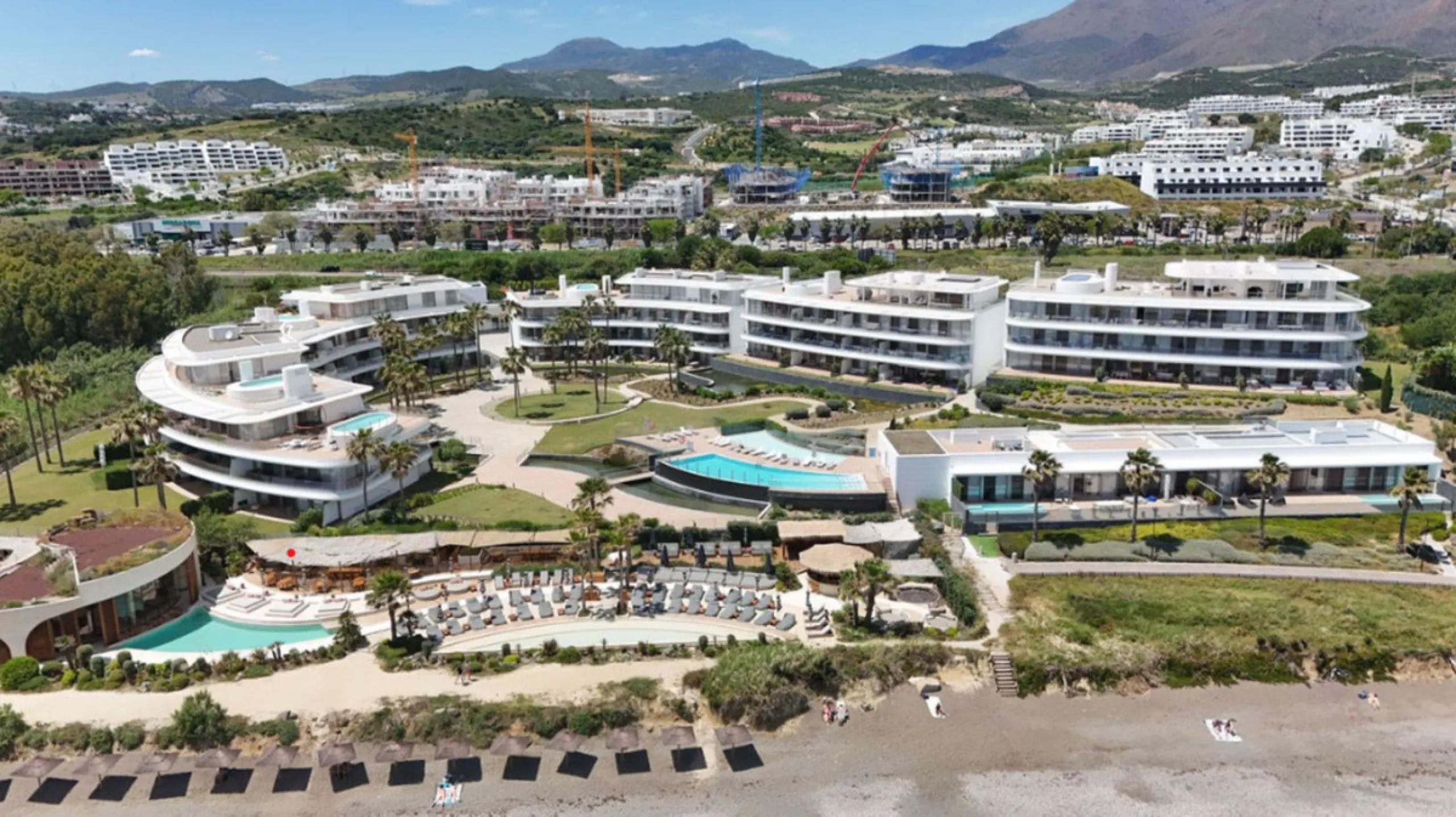 Welcome to this luxurious apartment located in the exclusive beachfront residential complex The Edge. This 2nd floor home offers four bedrooms and two bathrooms with exclusive Dornbracht finishes. The open concept living room and kitchen create a social a