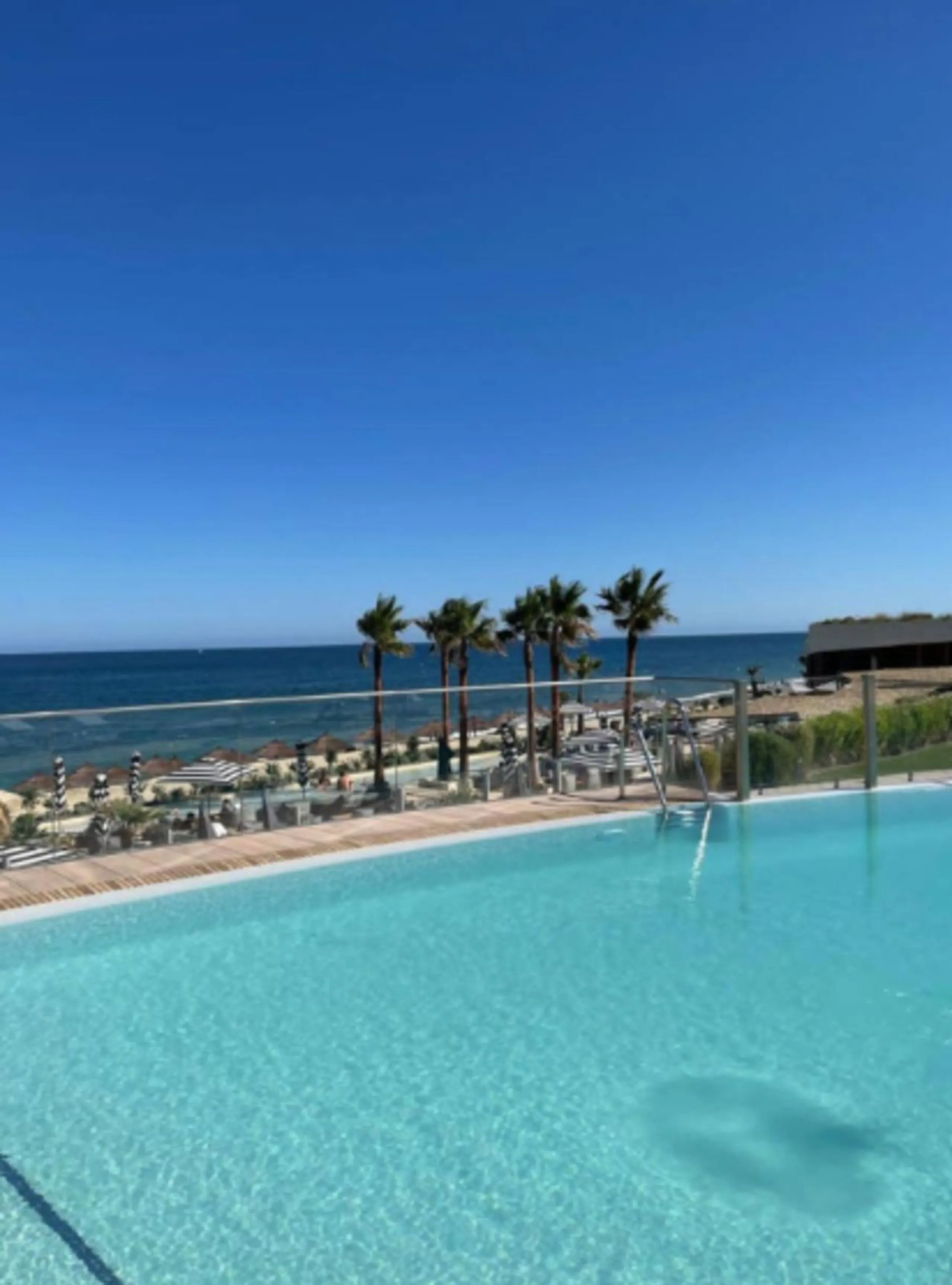 Welcome to this luxurious apartment located in the exclusive beachfront residential complex The Edge. This 2nd floor home offers four bedrooms and two bathrooms with exclusive Dornbracht finishes. The open concept living room and kitchen create a social a