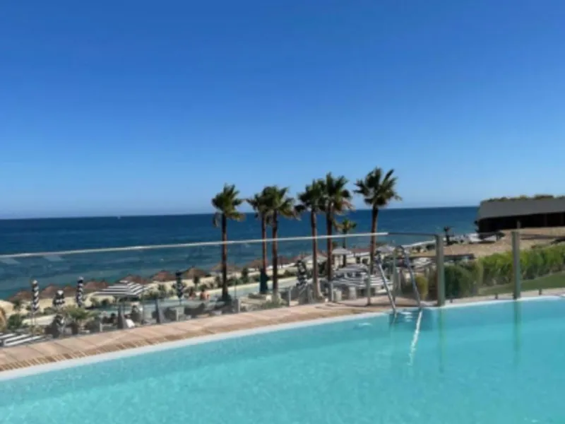 Welcome to this luxurious apartment located in the exclusive beachfront residential complex The Edge. This 2nd floor home offers four bedrooms and two bathrooms with exclusive Dornbracht finishes. The open concept living room and kitchen create a social a