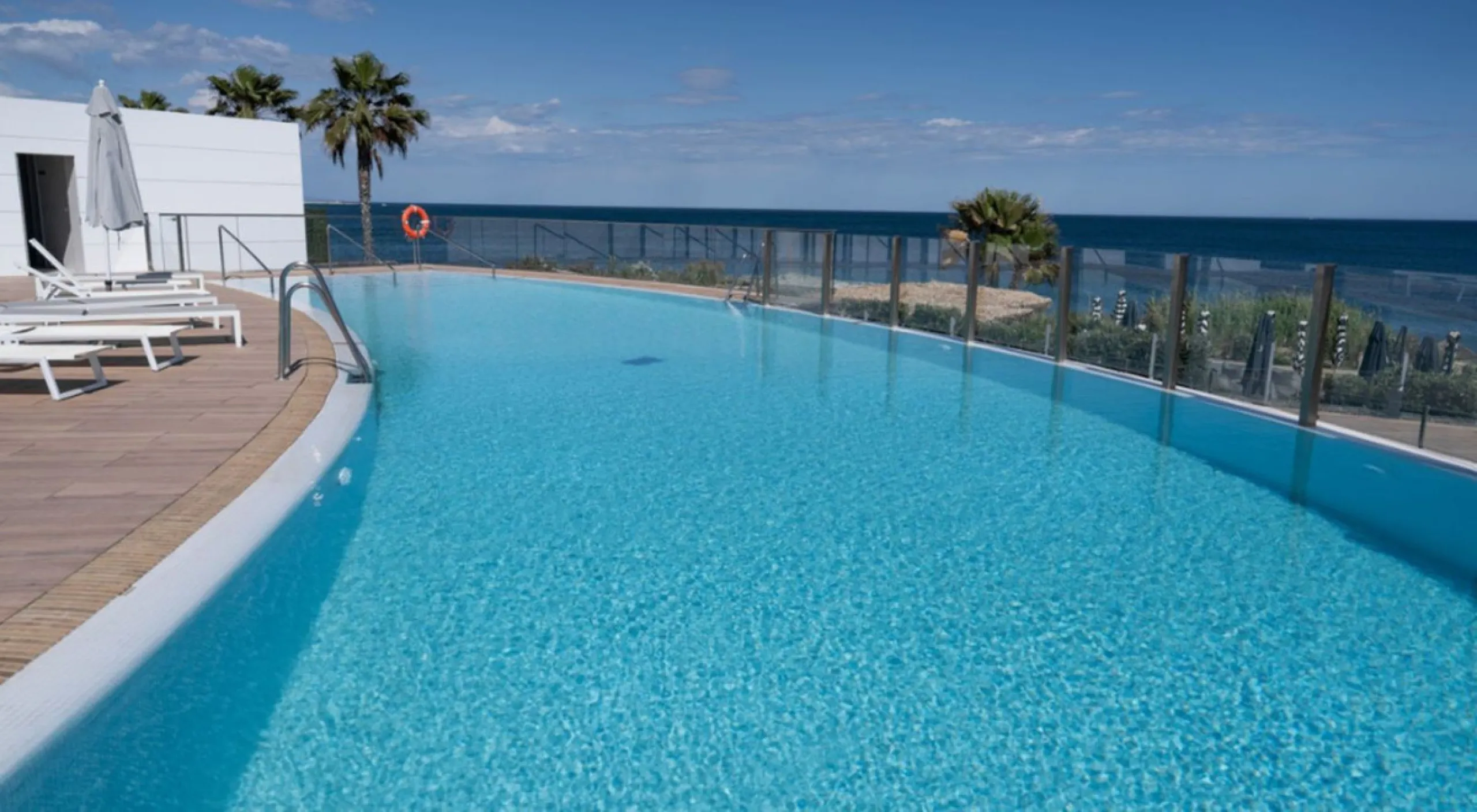 Welcome to this luxurious apartment located in the exclusive beachfront residential complex The Edge. This 2nd floor home offers four bedrooms and two bathrooms with exclusive Dornbracht finishes. The open concept living room and kitchen create a social a