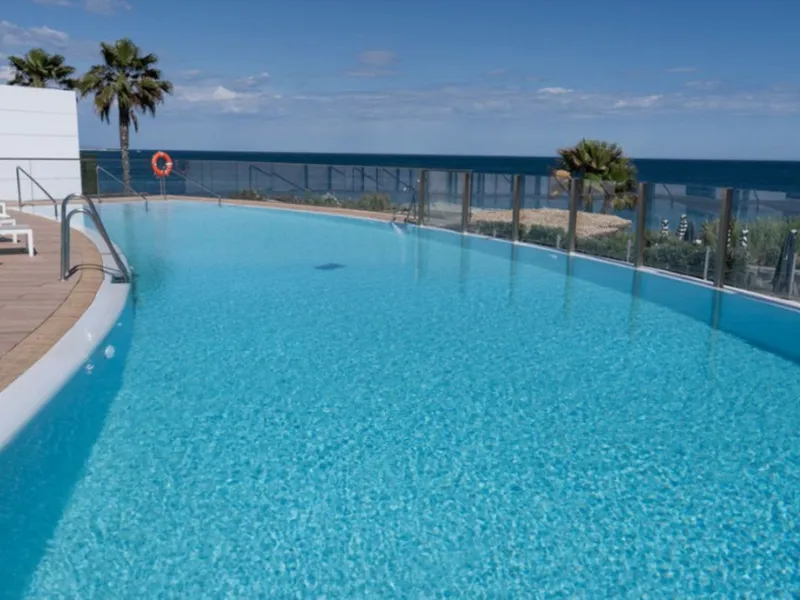Welcome to this luxurious apartment located in the exclusive beachfront residential complex The Edge. This 2nd floor home offers four bedrooms and two bathrooms with exclusive Dornbracht finishes. The open concept living room and kitchen create a social a