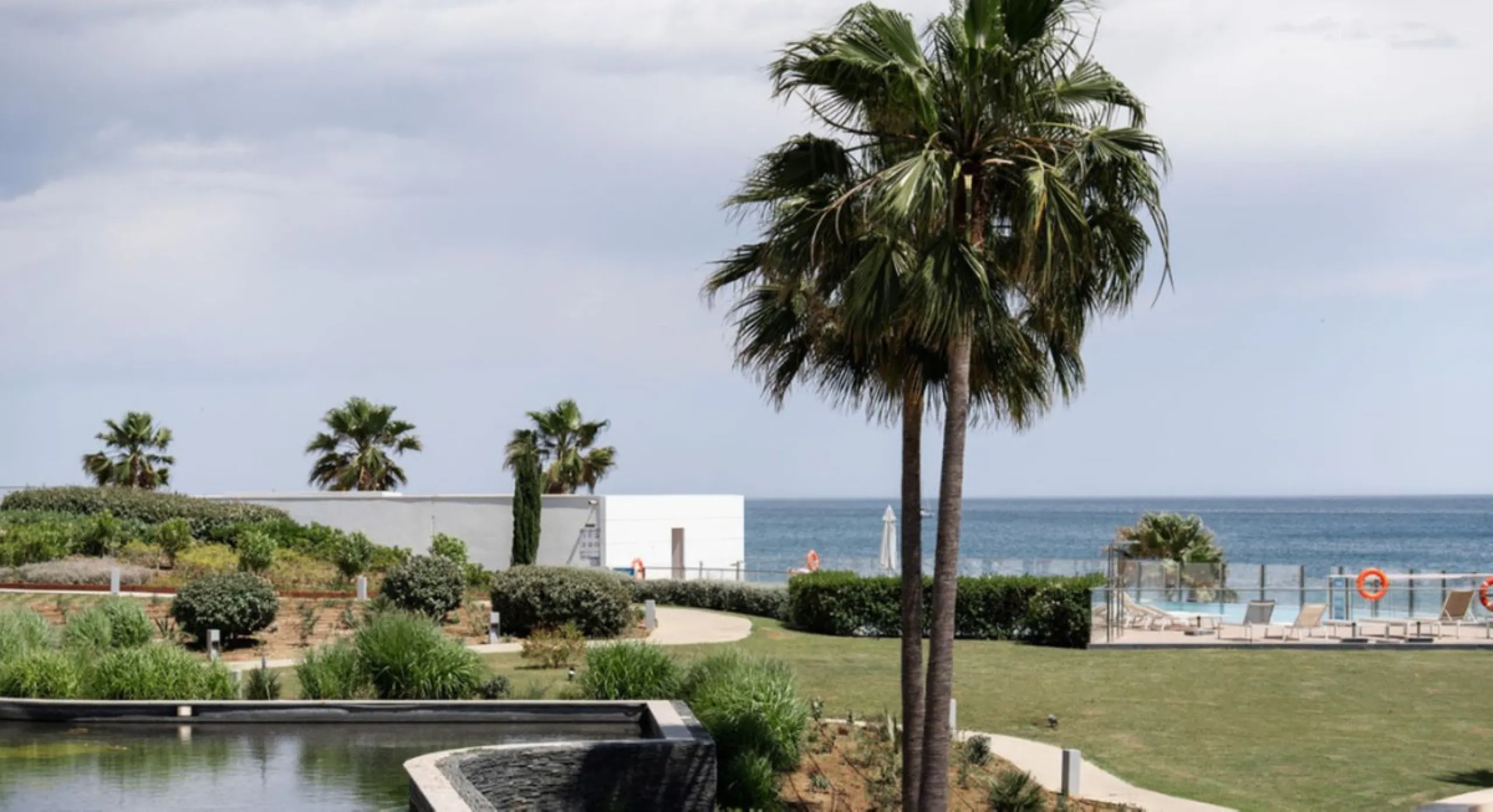 Welcome to this luxurious apartment located in the exclusive beachfront residential complex The Edge. This 2nd floor home offers four bedrooms and two bathrooms with exclusive Dornbracht finishes. The open concept living room and kitchen create a social a