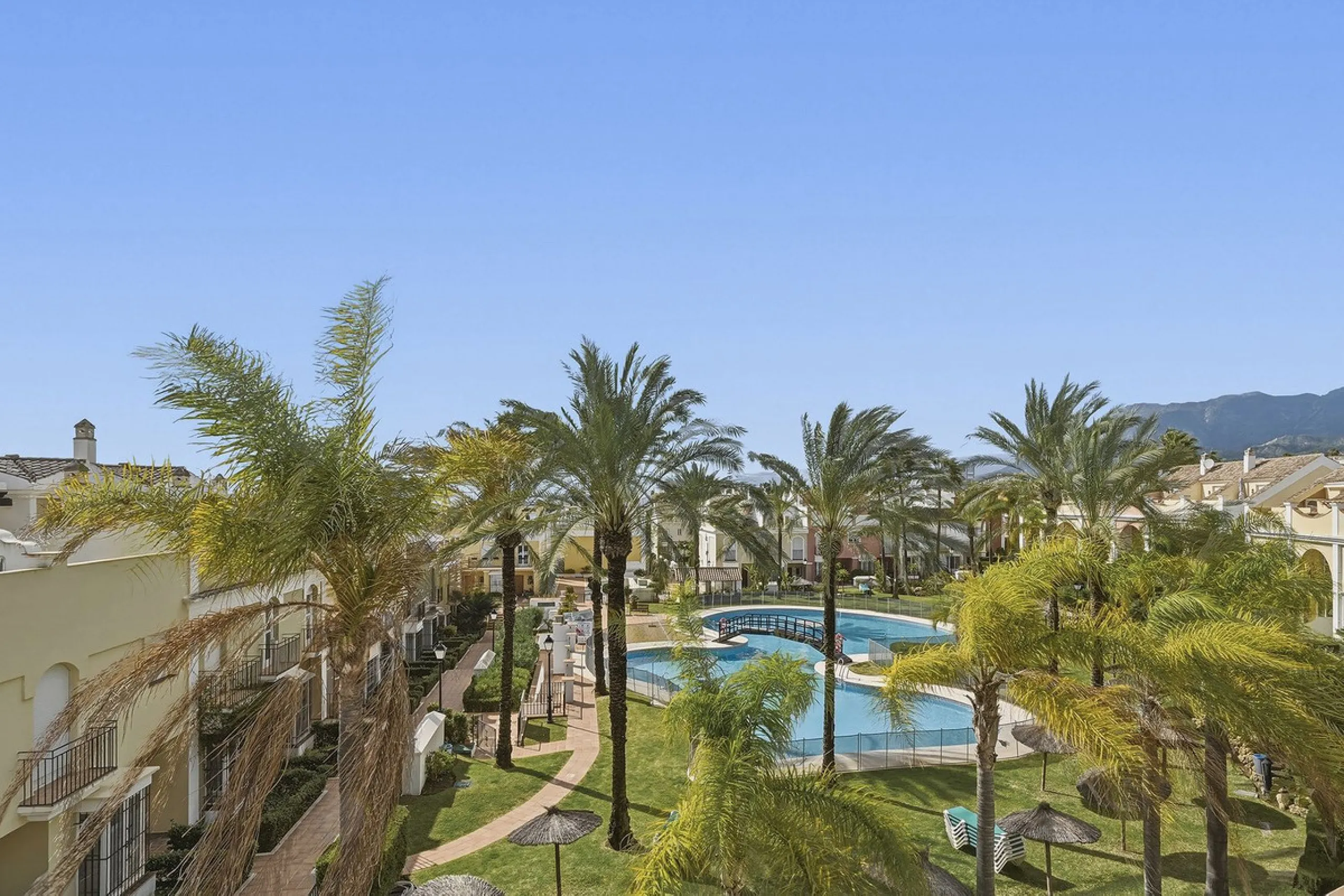 Nestled within one of Bahía de Marbella's most sought-after beachfront urbanizations, this stunning townhouse offers an unparalleled coastal living experience. Imagine waking up to the sound of the waves and having direct, private access to the golden san