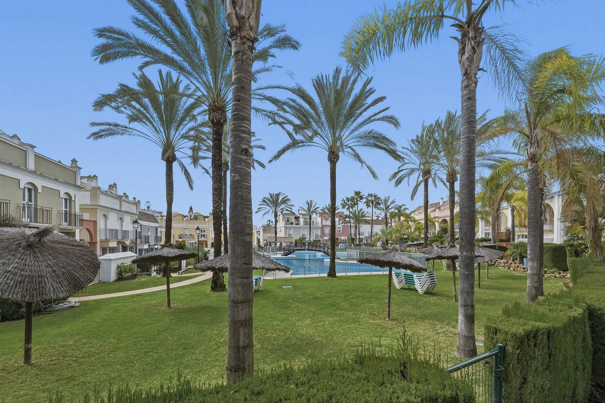 Nestled within one of Bahía de Marbella's most sought-after beachfront urbanizations, this stunning townhouse offers an unparalleled coastal living experience. Imagine waking up to the sound of the waves and having direct, private access to the golden san