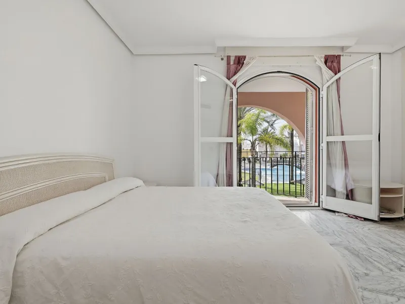 Nestled within one of Bahía de Marbella's most sought-after beachfront urbanizations, this stunning townhouse offers an unparalleled coastal living experience. Imagine waking up to the sound of the waves and having direct, private access to the golden san