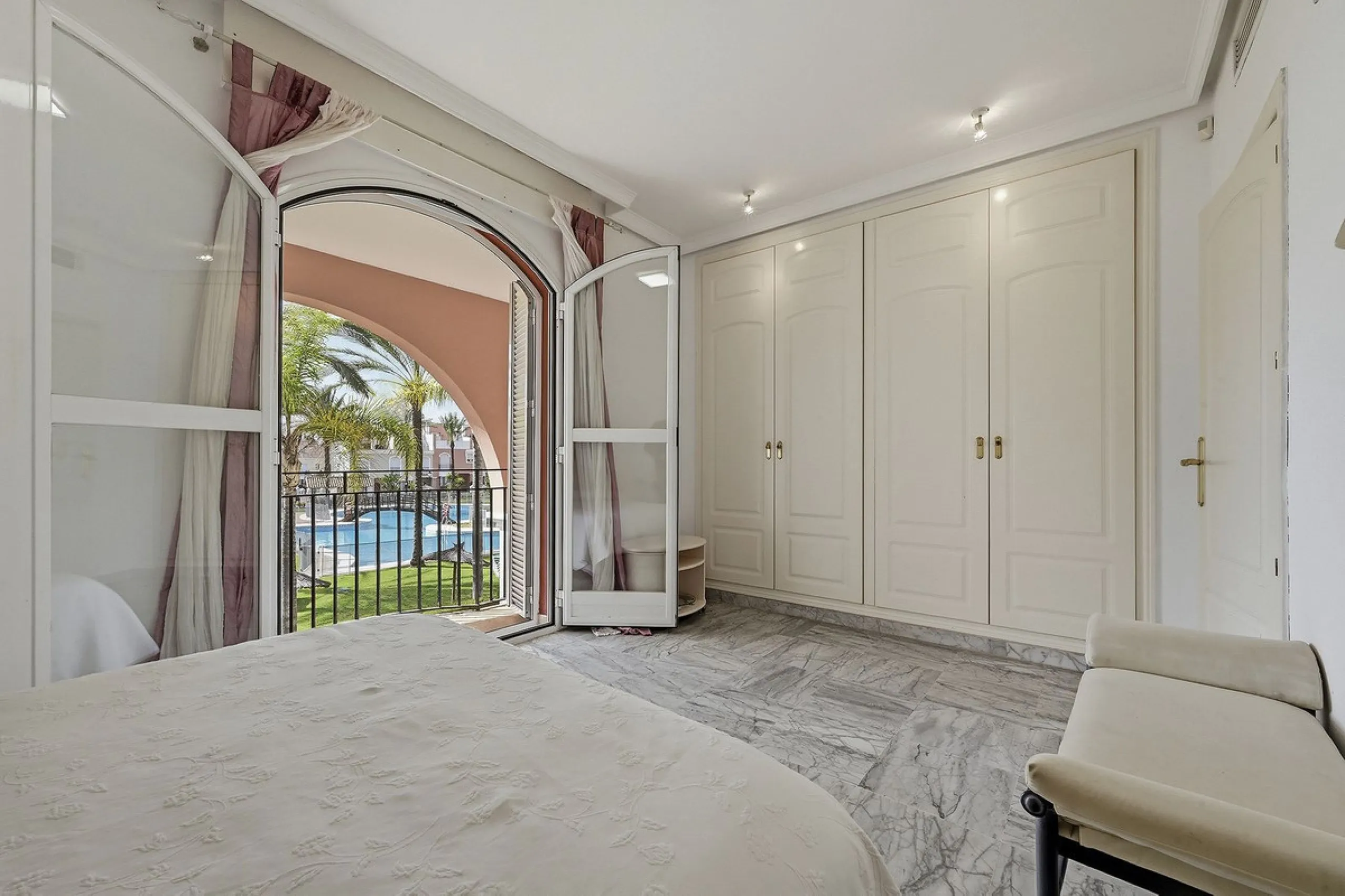 Nestled within one of Bahía de Marbella's most sought-after beachfront urbanizations, this stunning townhouse offers an unparalleled coastal living experience. Imagine waking up to the sound of the waves and having direct, private access to the golden san