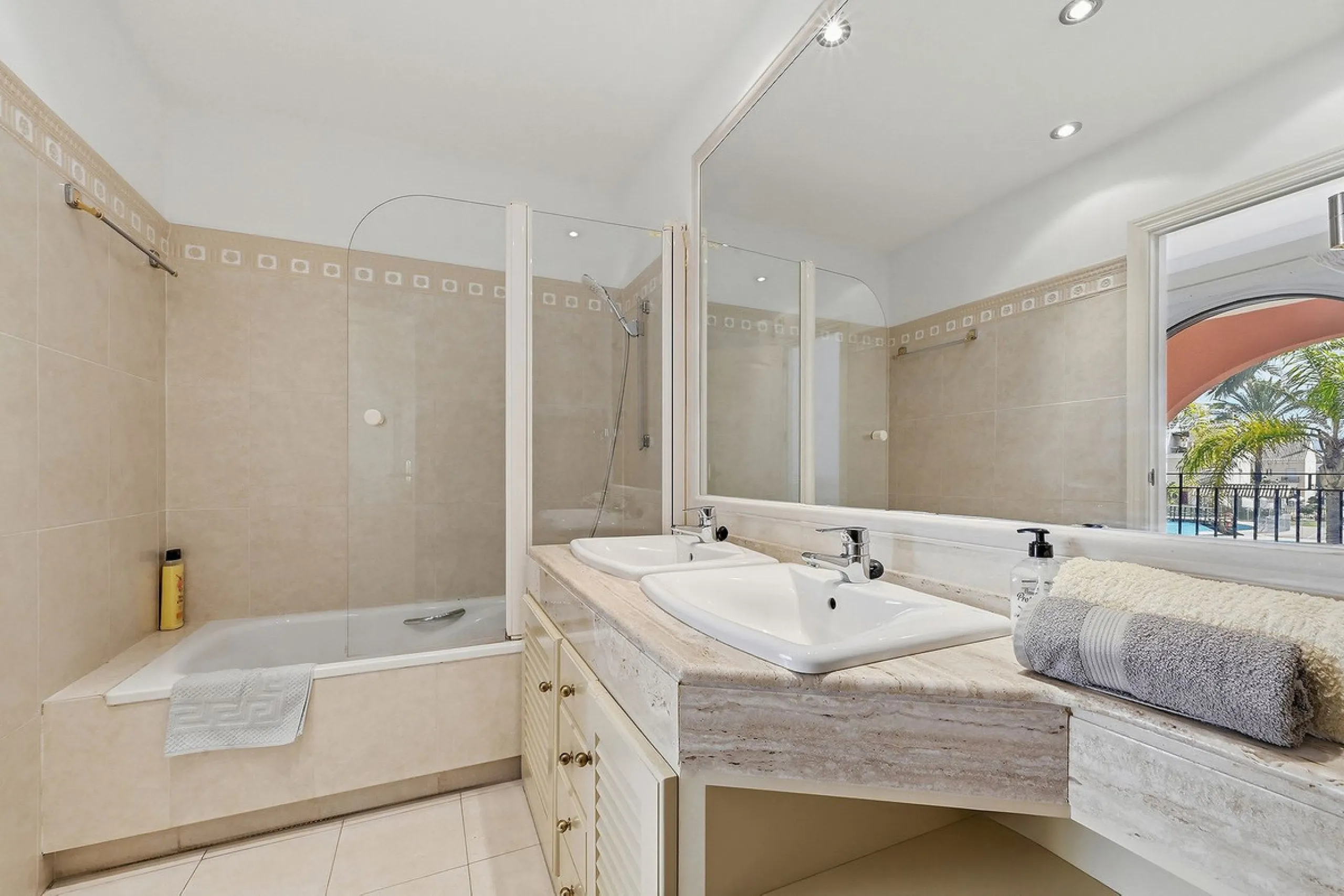 Nestled within one of Bahía de Marbella's most sought-after beachfront urbanizations, this stunning townhouse offers an unparalleled coastal living experience. Imagine waking up to the sound of the waves and having direct, private access to the golden san