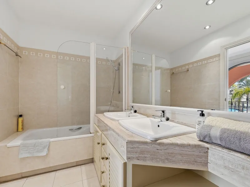 Nestled within one of Bahía de Marbella's most sought-after beachfront urbanizations, this stunning townhouse offers an unparalleled coastal living experience. Imagine waking up to the sound of the waves and having direct, private access to the golden san