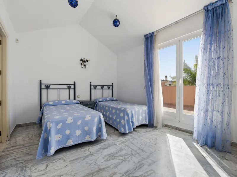 Nestled within one of Bahía de Marbella's most sought-after beachfront urbanizations, this stunning townhouse offers an unparalleled coastal living experience. Imagine waking up to the sound of the waves and having direct, private access to the golden san