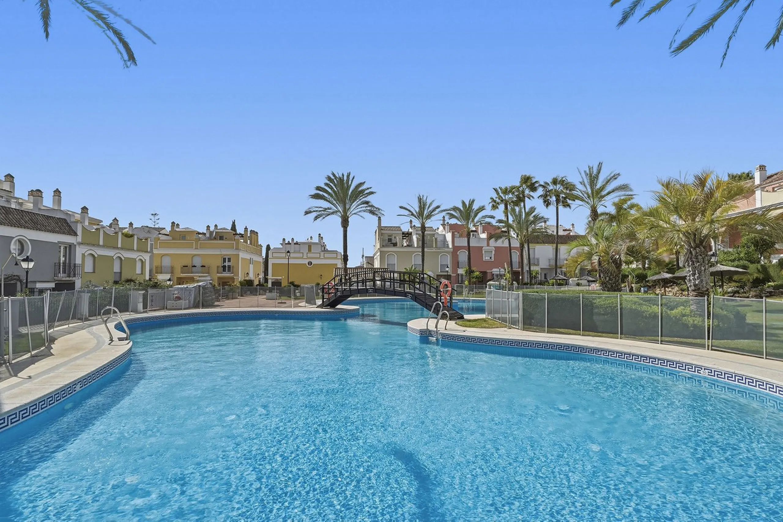 Nestled within one of Bahía de Marbella's most sought-after beachfront urbanizations, this stunning townhouse offers an unparalleled coastal living experience. Imagine waking up to the sound of the waves and having direct, private access to the golden san