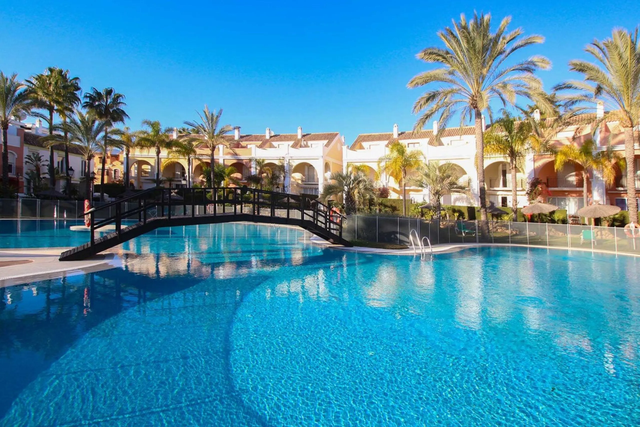 Nestled within one of Bahía de Marbella's most sought-after beachfront urbanizations, this stunning townhouse offers an unparalleled coastal living experience. Imagine waking up to the sound of the waves and having direct, private access to the golden san