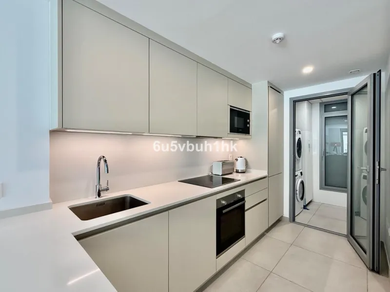 Welcome to your new home just 300 metres from one of Marbella's finest beaches, where modern comfort meets relaxed coastal living. This beautiful ground-floor apartment is located in an elegant and contemporary residential community designed to offer conv