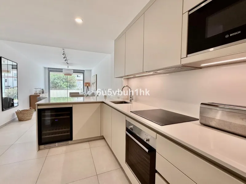 Welcome to your new home just 300 metres from one of Marbella's finest beaches, where modern comfort meets relaxed coastal living. This beautiful ground-floor apartment is located in an elegant and contemporary residential community designed to offer conv