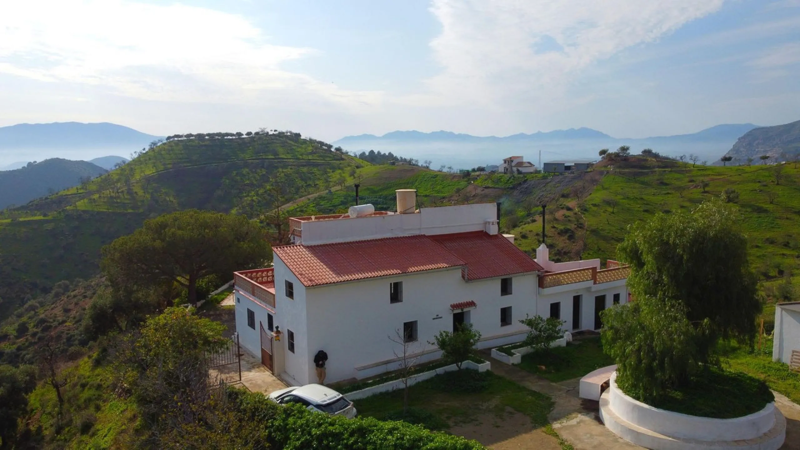 For sale: a characterful and authentic Spanish finca just 15 minutes from the lively village of Pizarra, right in the heart of Andalusia. This unique property boasts an impressive 63,766 m² of private land and features two fully independent homes — ideal 