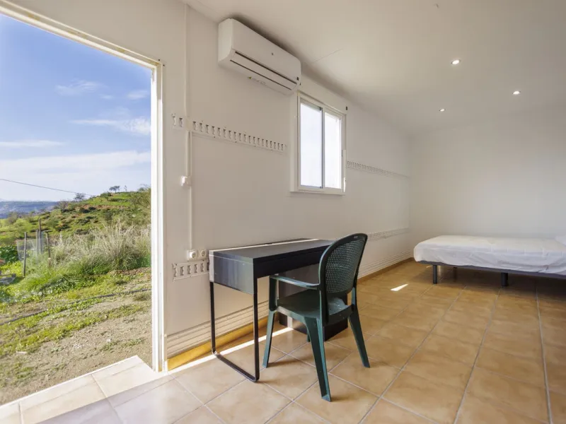 For sale: a characterful and authentic Spanish finca just 15 minutes from the lively village of Pizarra, right in the heart of Andalusia. This unique property boasts an impressive 63,766 m² of private land and features two fully independent homes — ideal 