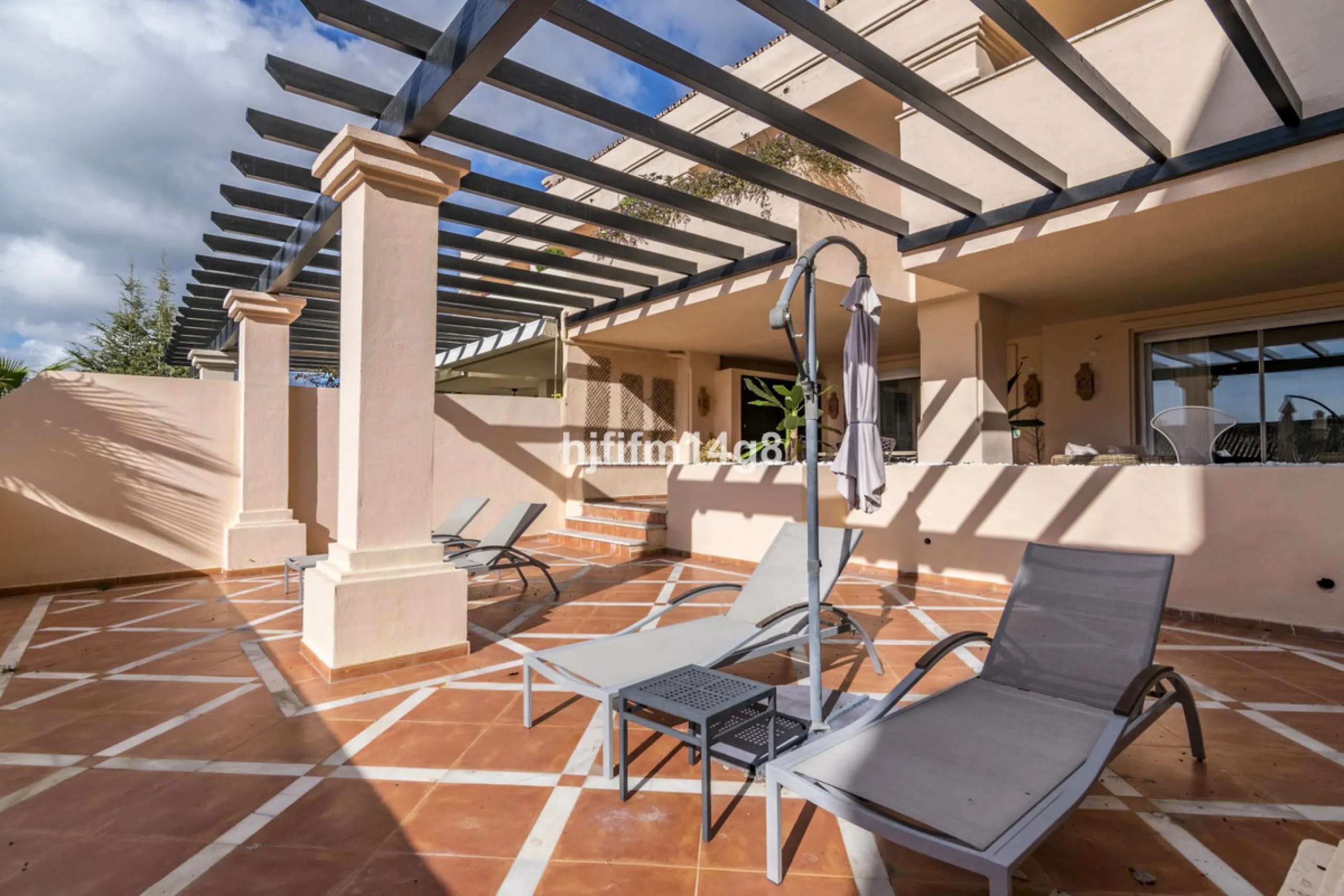 Discover this elegant two-bedroom elevated ground floor apartment for sale in the sought-after Albatross Hill complex, nestled in the scenic hills of Nueva Andalucía. This exclusive gated community offers a peaceful, secure lifestyle with outstanding amen
