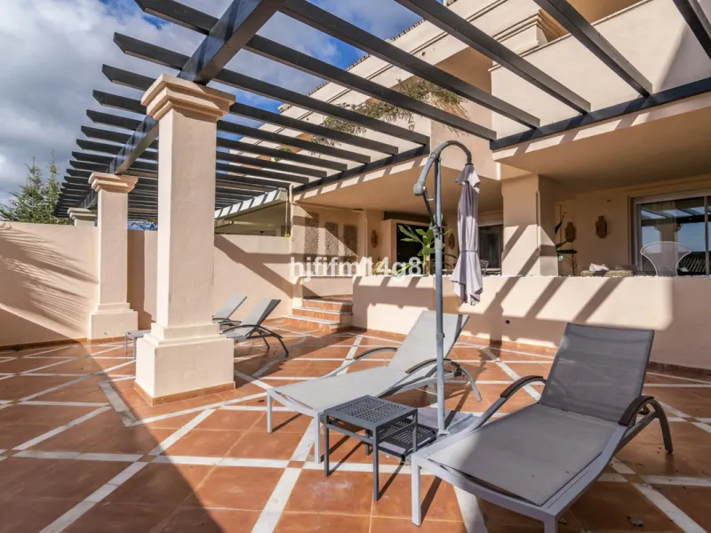 Discover this elegant two-bedroom elevated ground floor apartment for sale in the sought-after Albatross Hill complex, nestled in the scenic hills of Nueva Andalucía. This exclusive gated community offers a peaceful, secure lifestyle with outstanding amen