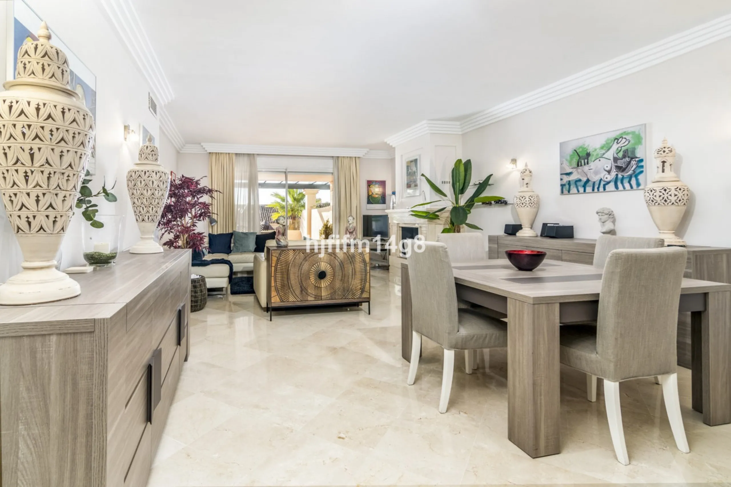 Discover this elegant two-bedroom elevated ground floor apartment for sale in the sought-after Albatross Hill complex, nestled in the scenic hills of Nueva Andalucía. This exclusive gated community offers a peaceful, secure lifestyle with outstanding amen