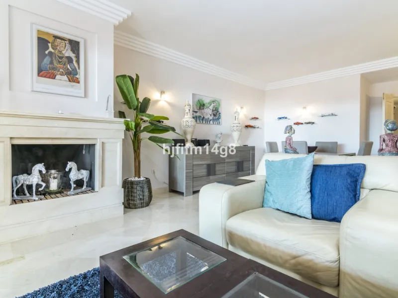 Discover this elegant two-bedroom elevated ground floor apartment for sale in the sought-after Albatross Hill complex, nestled in the scenic hills of Nueva Andalucía. This exclusive gated community offers a peaceful, secure lifestyle with outstanding amen