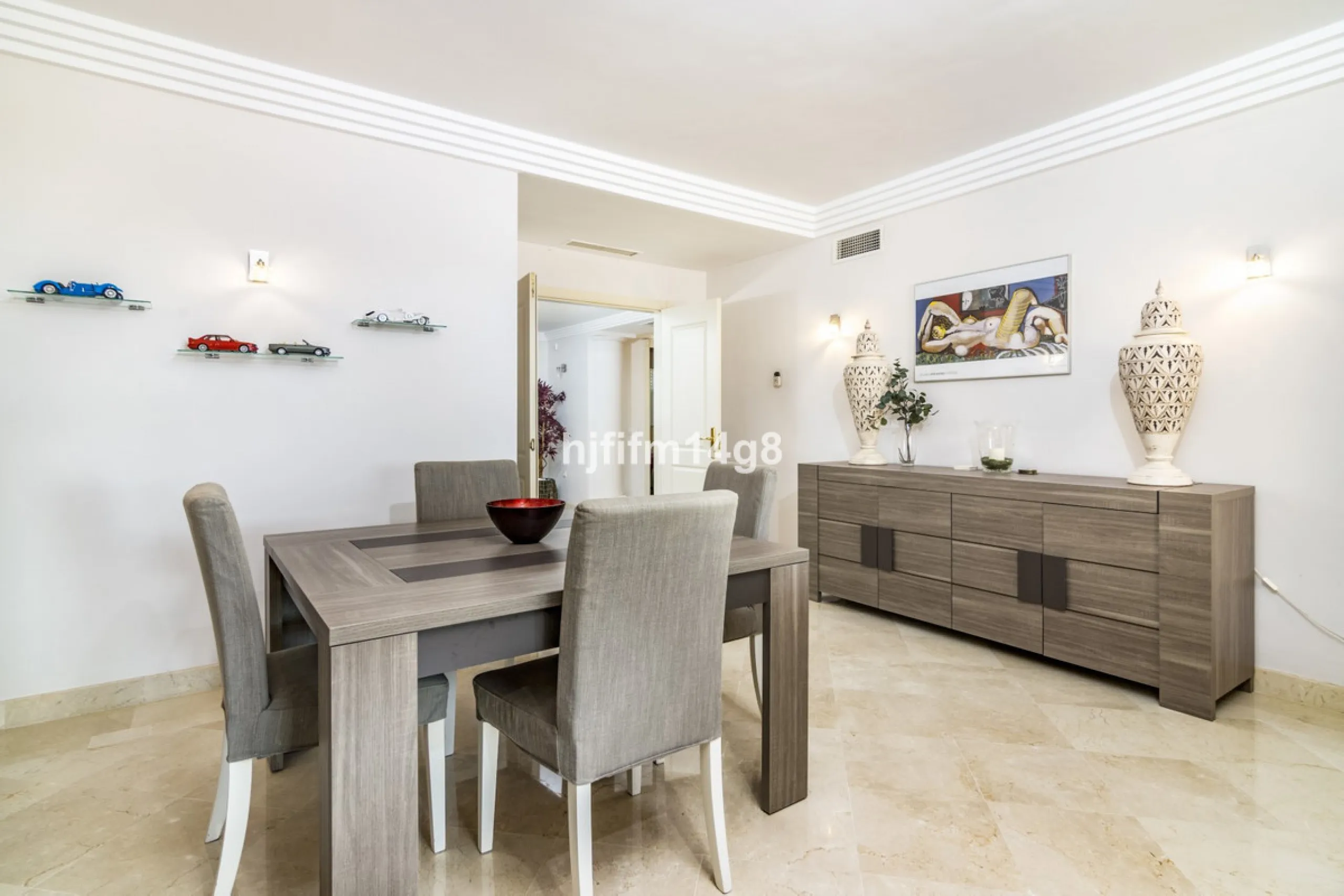Discover this elegant two-bedroom elevated ground floor apartment for sale in the sought-after Albatross Hill complex, nestled in the scenic hills of Nueva Andalucía. This exclusive gated community offers a peaceful, secure lifestyle with outstanding amen