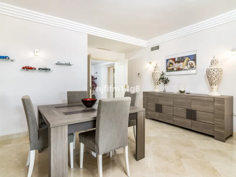 Discover this elegant two-bedroom elevated ground floor apartment for sale in the sought-after Albatross Hill complex, nestled in the scenic hills of Nueva Andalucía. This exclusive gated community offers a peaceful, secure lifestyle with outstanding amen