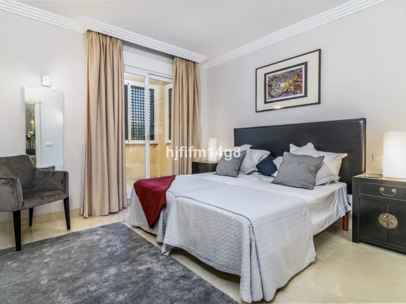 Discover this elegant two-bedroom elevated ground floor apartment for sale in the sought-after Albatross Hill complex, nestled in the scenic hills of Nueva Andalucía. This exclusive gated community offers a peaceful, secure lifestyle with outstanding amen