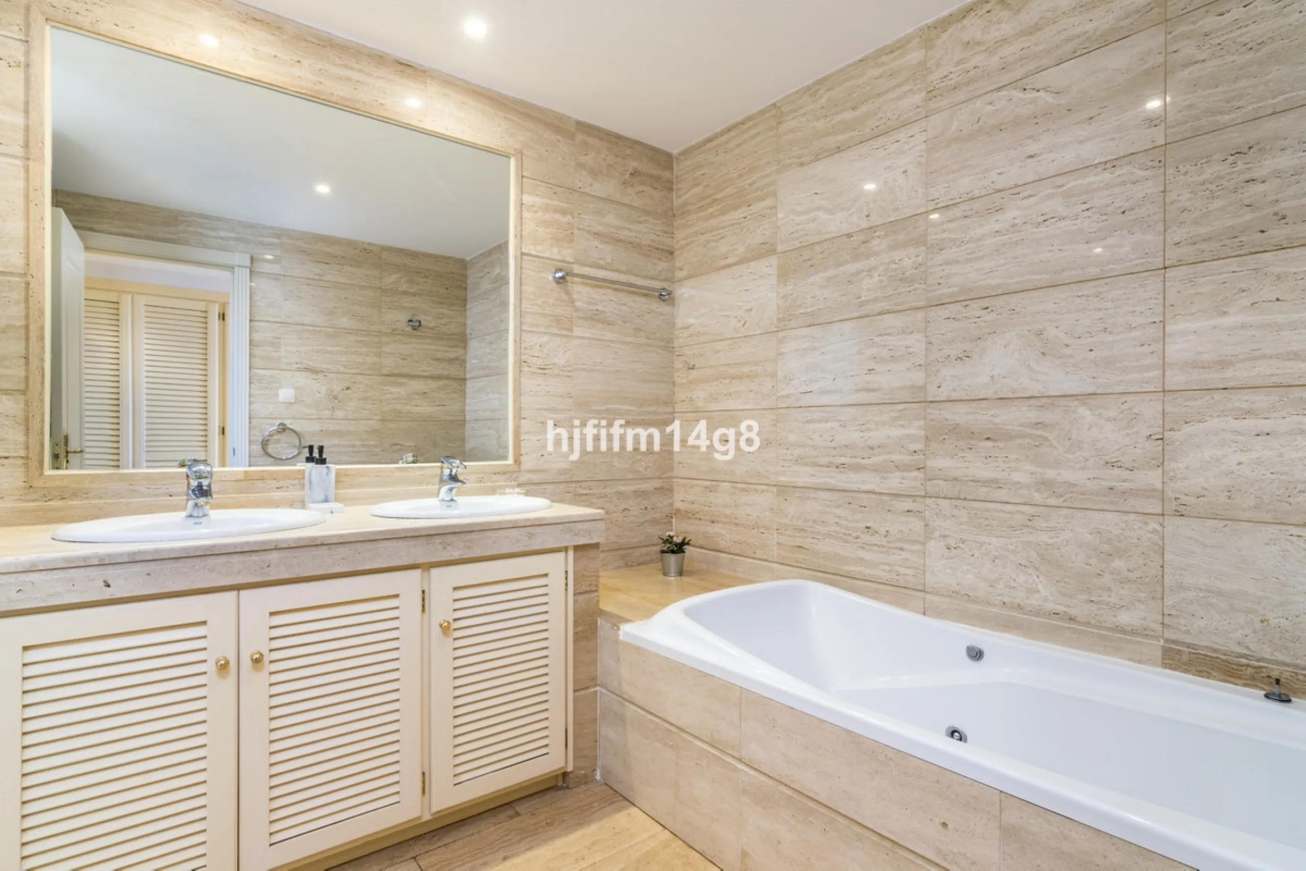 Discover this elegant two-bedroom elevated ground floor apartment for sale in the sought-after Albatross Hill complex, nestled in the scenic hills of Nueva Andalucía. This exclusive gated community offers a peaceful, secure lifestyle with outstanding amen
